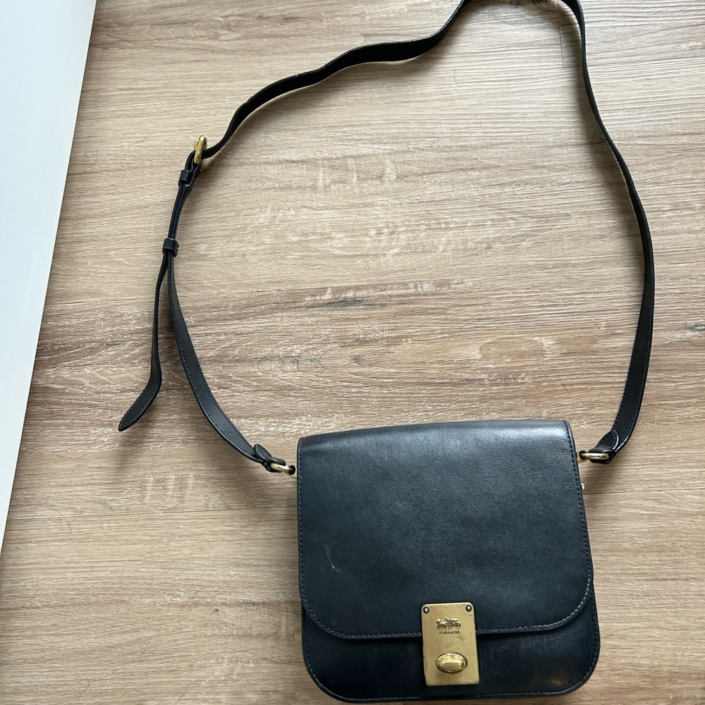 Sleek Black Leather Crossbody Bag with Gold Clasp